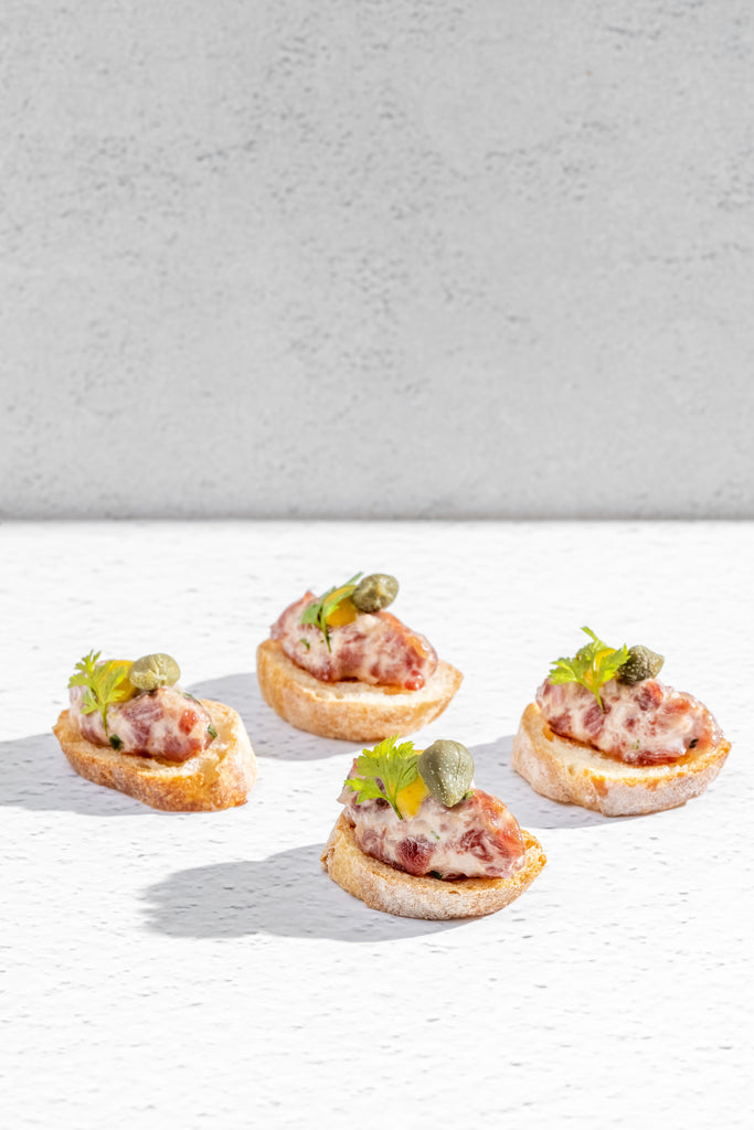 Beef Tartar Polmard, Capers, Savora Mustard on Toasted Baguette (One Dozen)